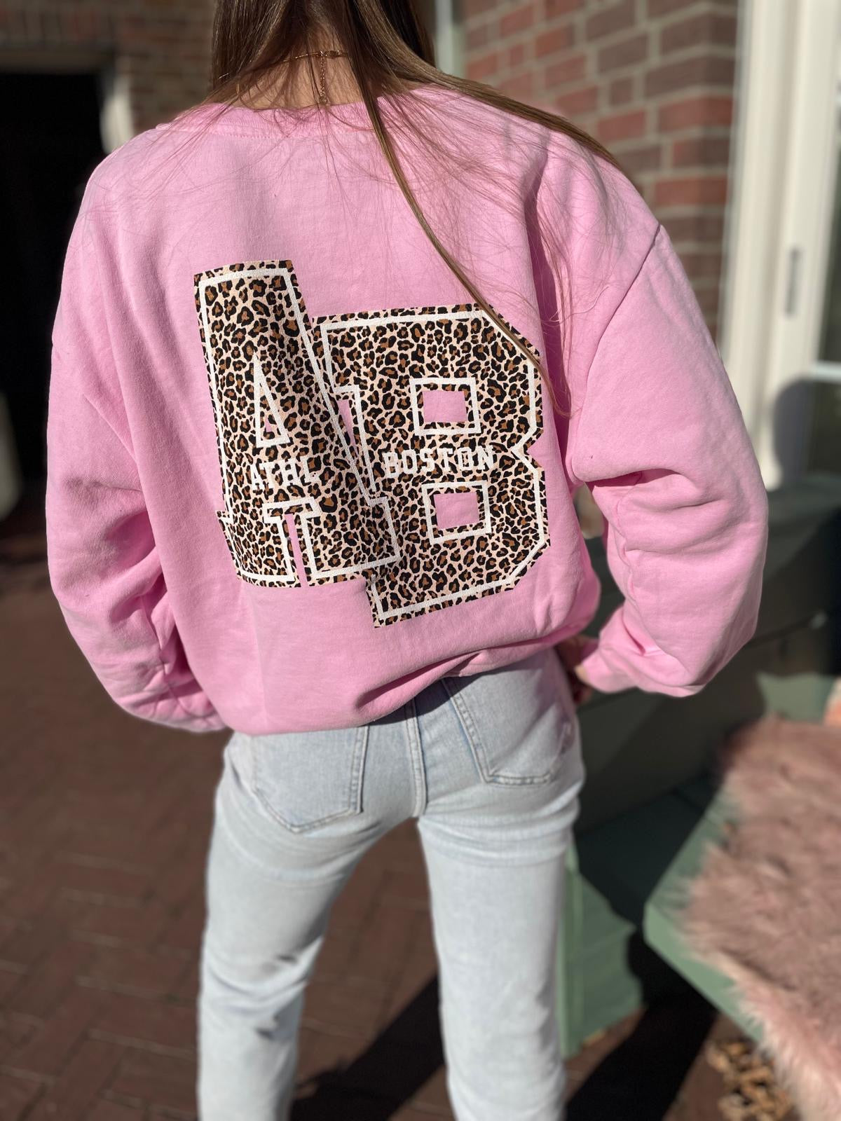 Rose sweater met panterprint embleem